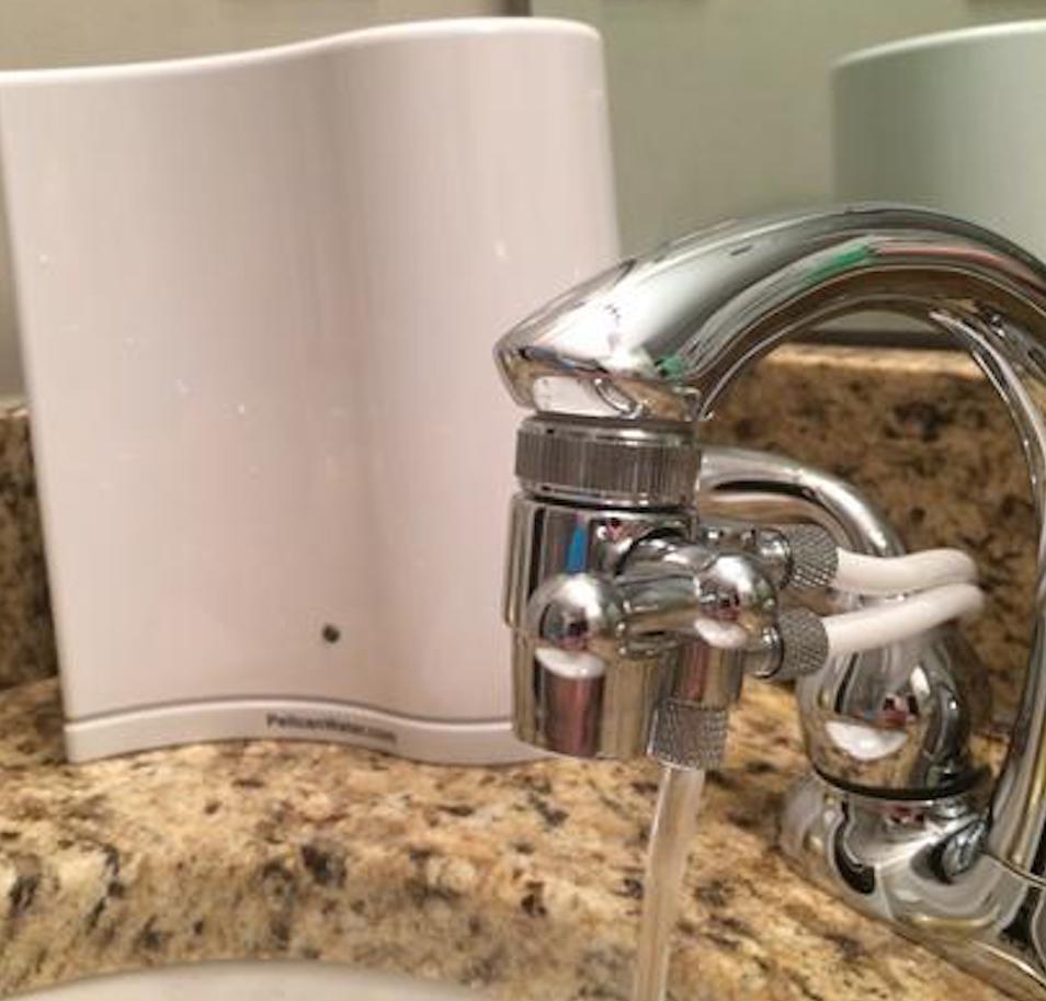 water filter on counter by faucet