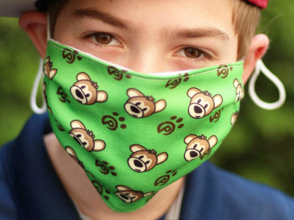 Boy wearing a bear themed face mask