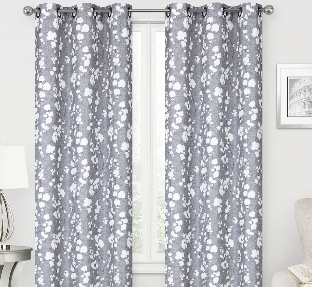 blue and white printed curtain panels on white window