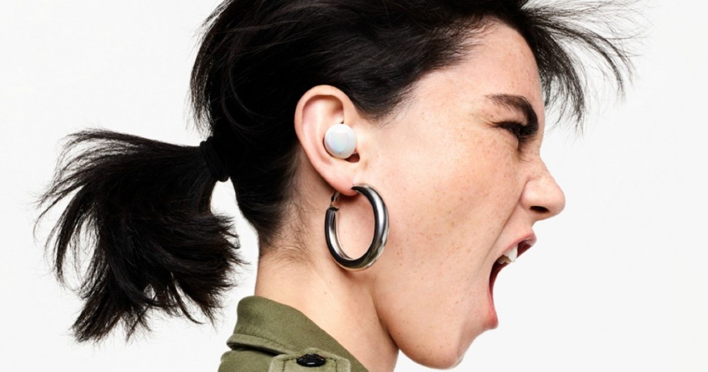 woman shouting while wearing earbuds