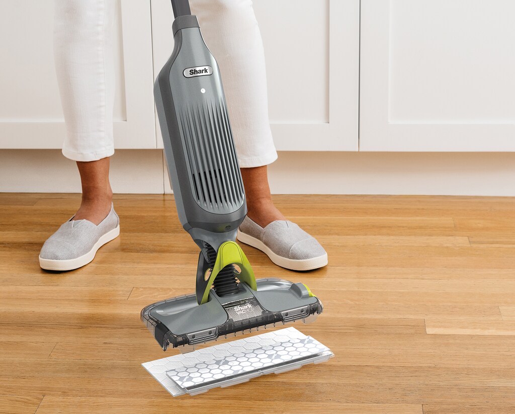 woman with a vacuum mop