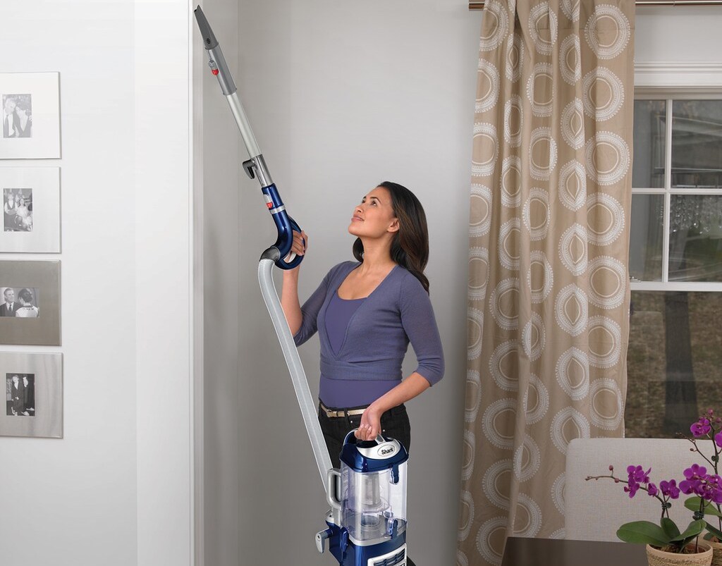 woman using a vacuum 