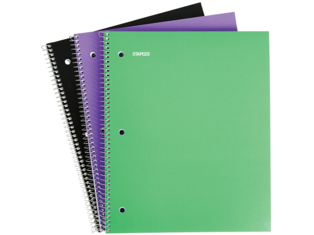 black notebook, purple notebook, and green notebook