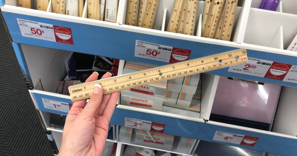 hand holding a ruler