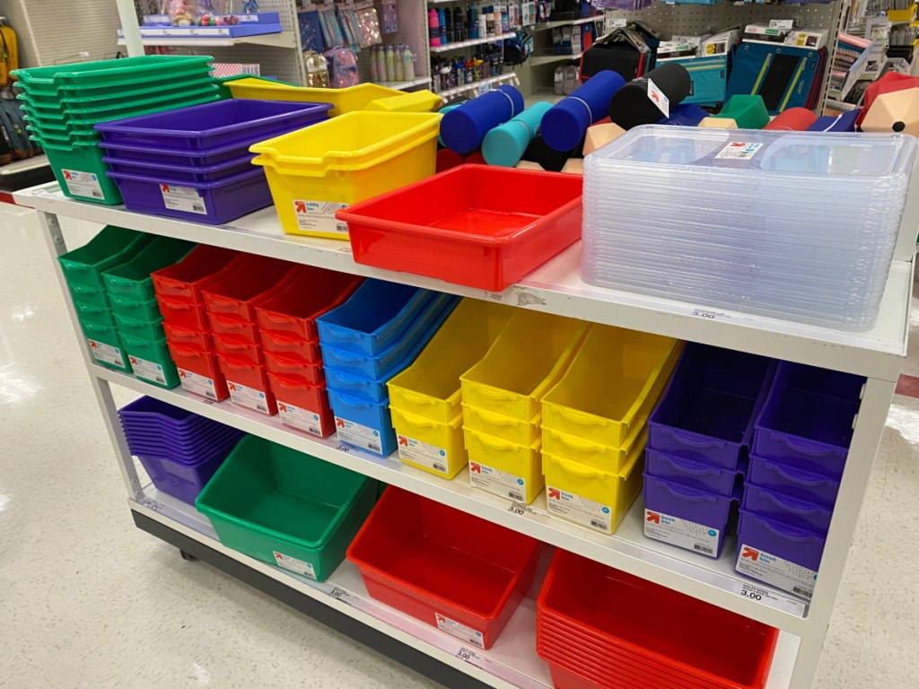various colorful school supplies on shelves in store