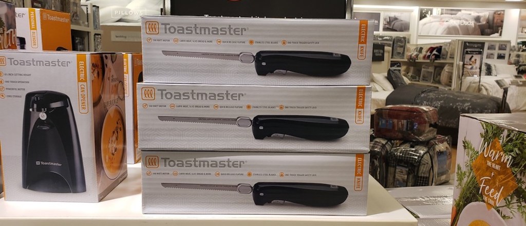three boxes of Toastmaster Electric Knife on shelf