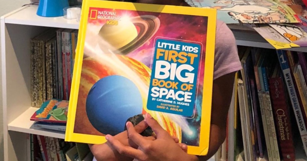 national geographic kids space book little girl holding book