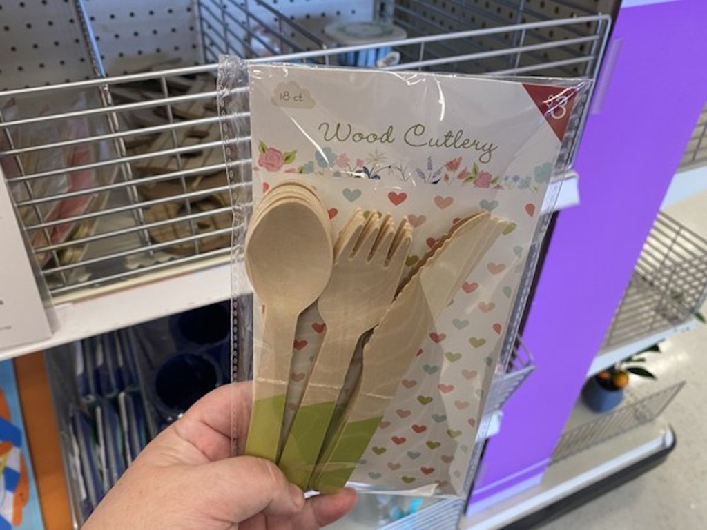 hand holding wood cutlery set from the Target Bullseye