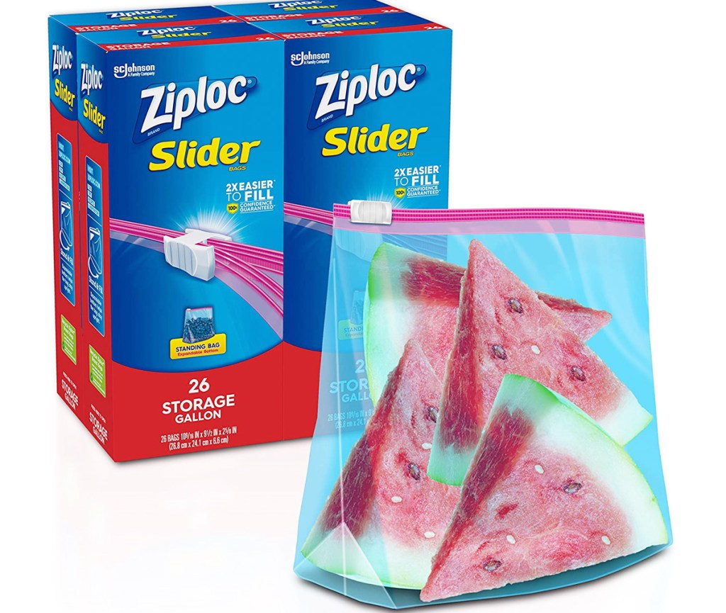 four blue boxes of ziplock slider bags with a bag in front filled with watermelon slices