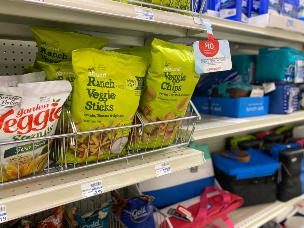 bags of chips on a shelf at CVS