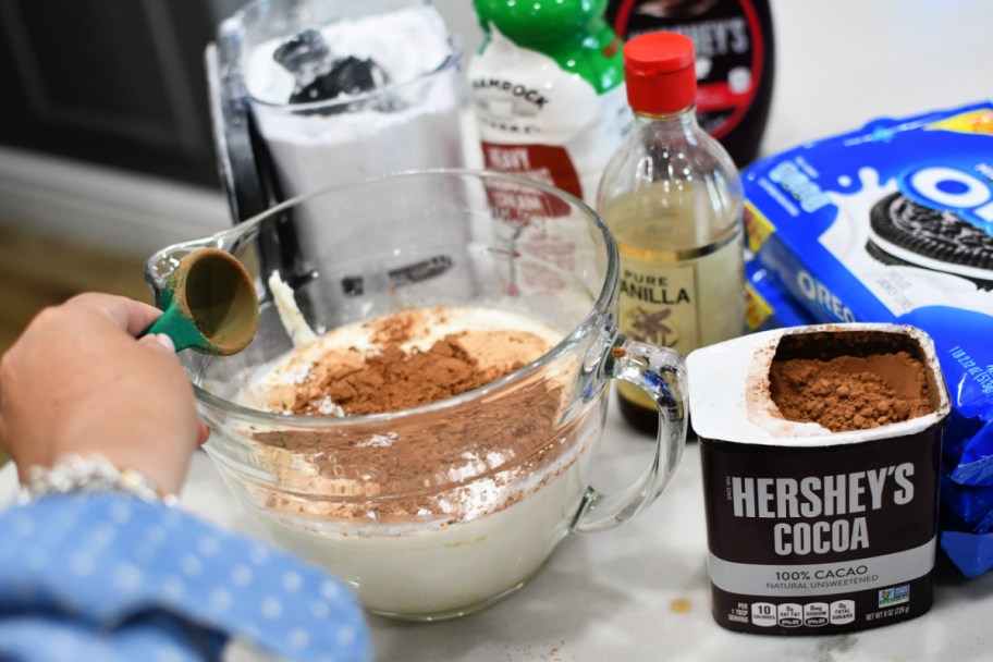 adding cocoa powder to whipping cream