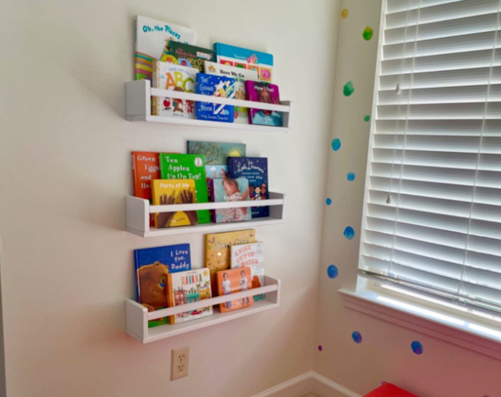 wooden shelves with books hanging on wall