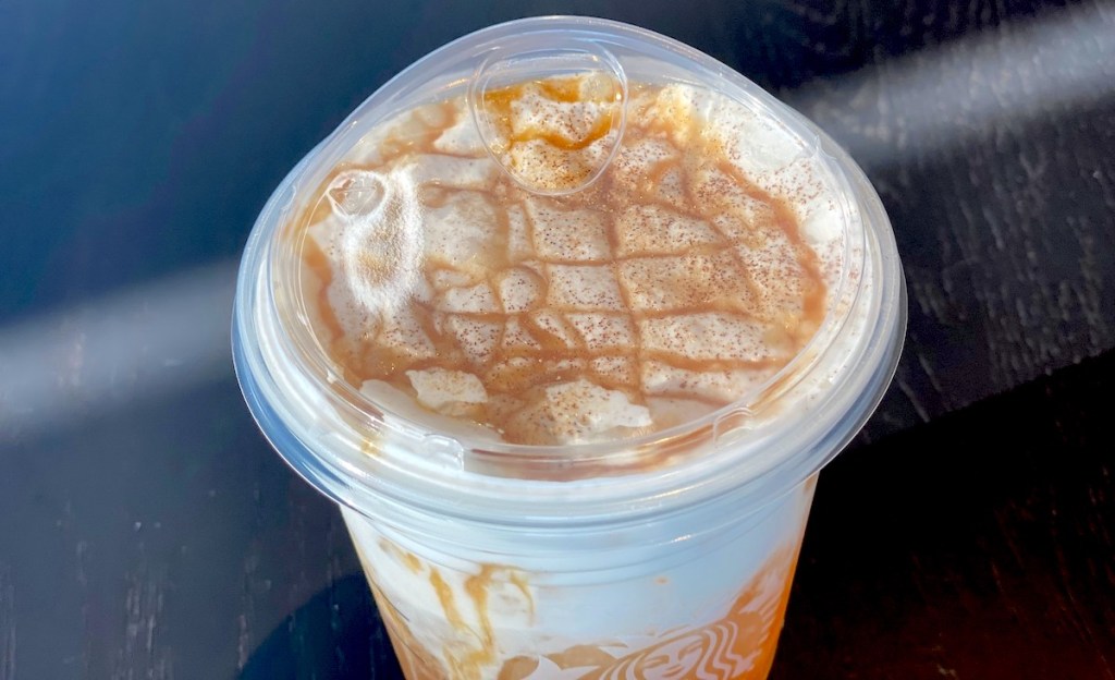 starbucks cup with caramel and whipped topping 