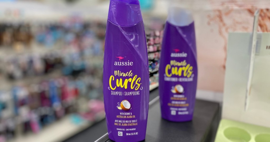 store with 2 purple bottles of shampoo on counter