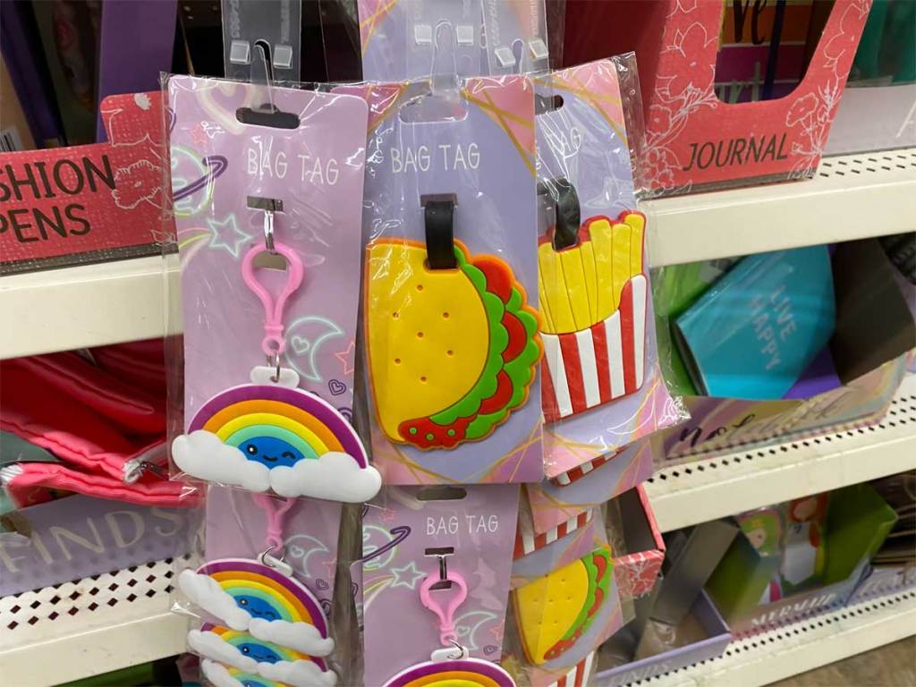 collection of bag tags on display in a store