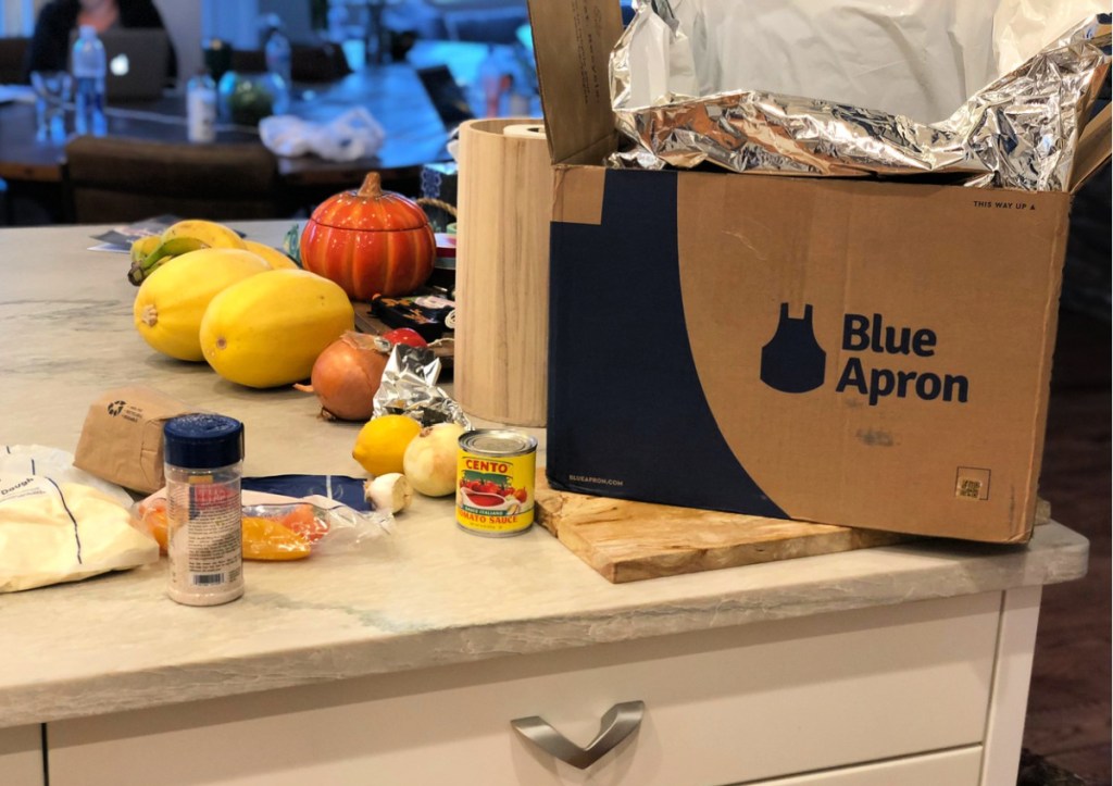 blue apron box on counter with ingredients