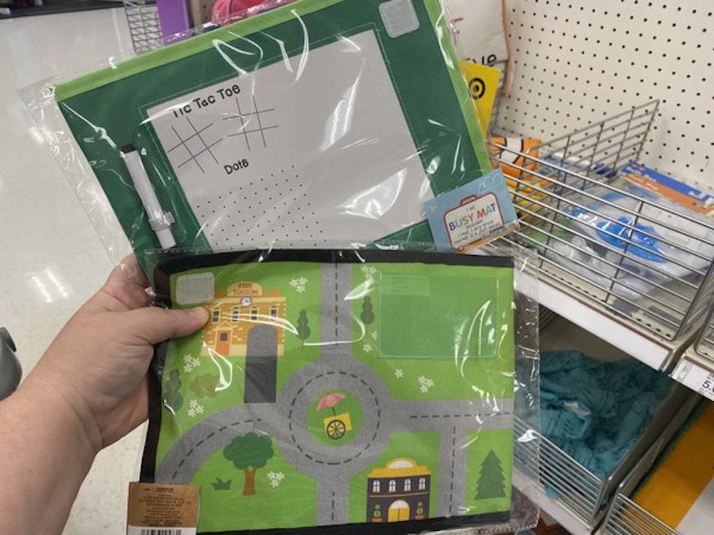 hand holding two busy mats from the Target Bullseye