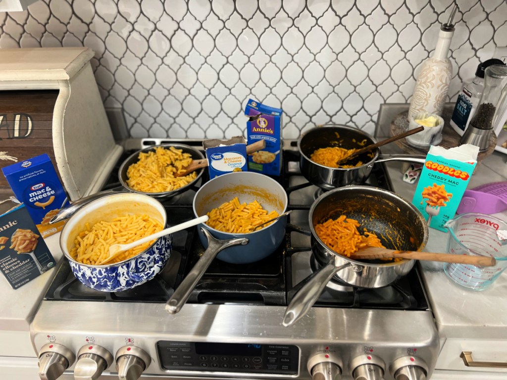 cooking 5 boxed mac and cheese brands on the stove
