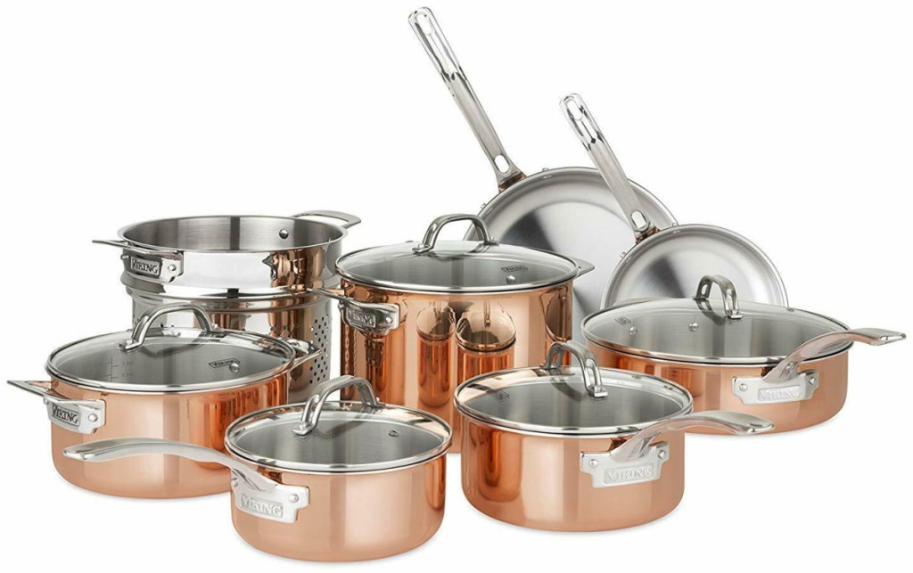 set of pots and pans in copper color on white background