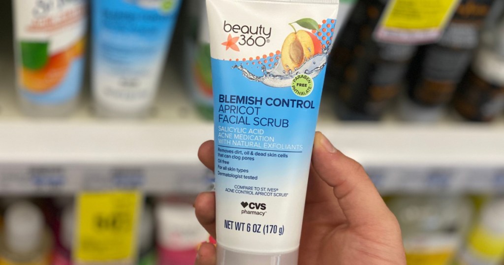 hand holding cvs health apricot scrub in store