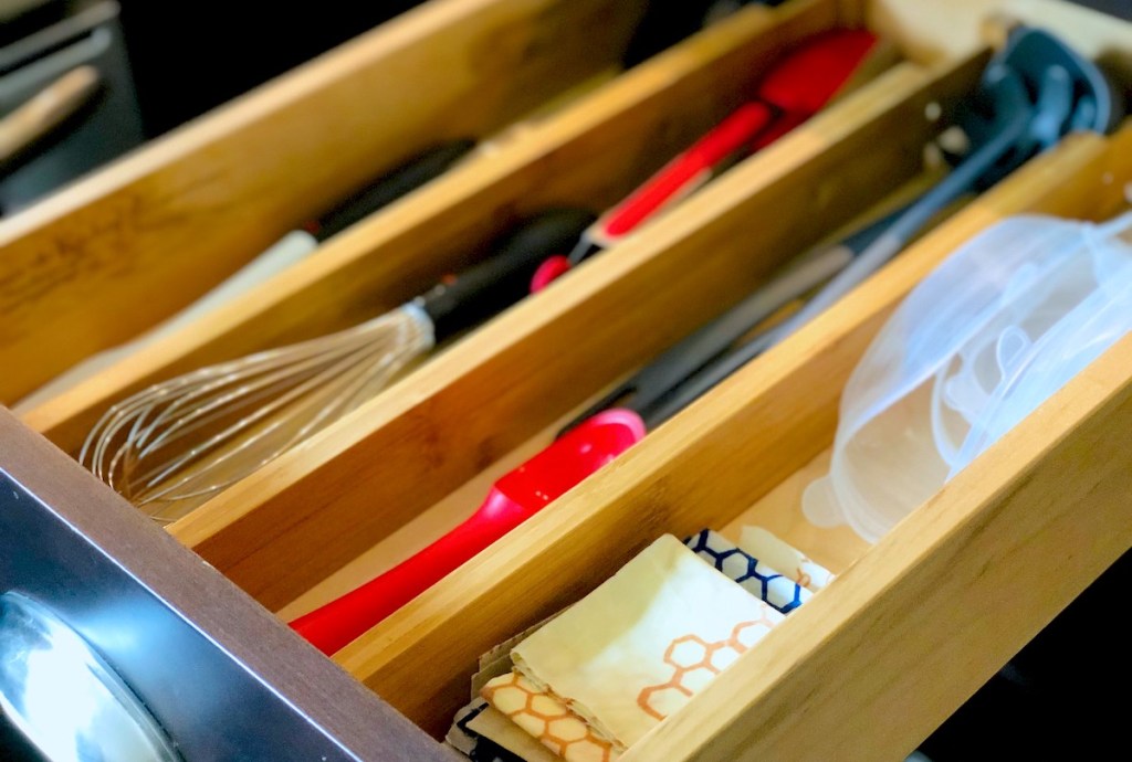 close up of kitchen utensils in drawer with organizers