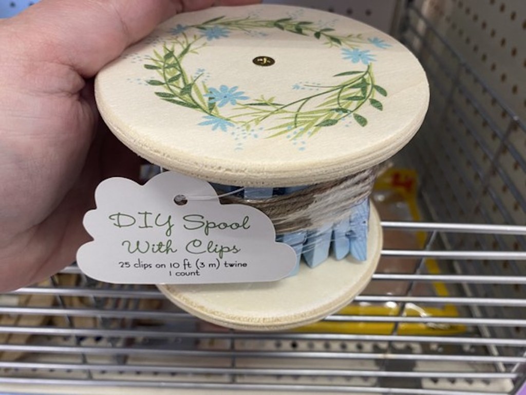hand holding diy spool with blue colored clips from the Target Bullseye