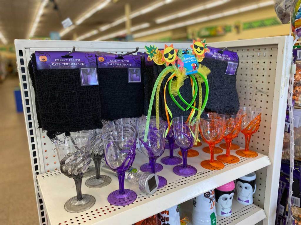plastic cups with clear colored plastic hands as stems on store display