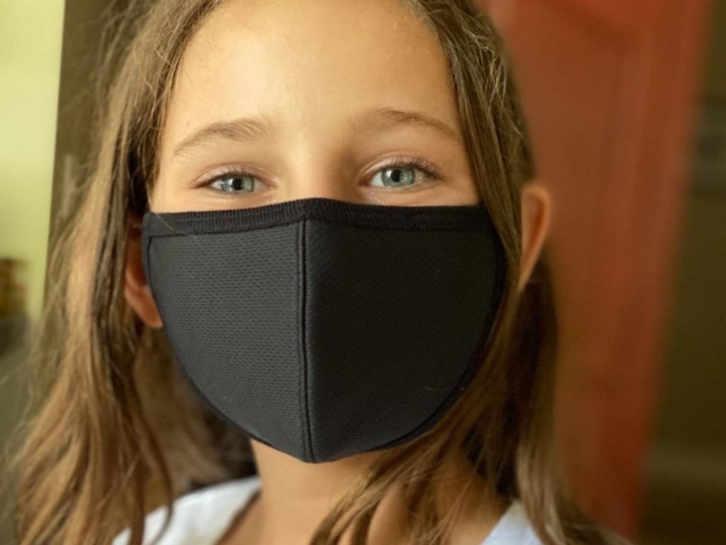 girl wearing black face mask
