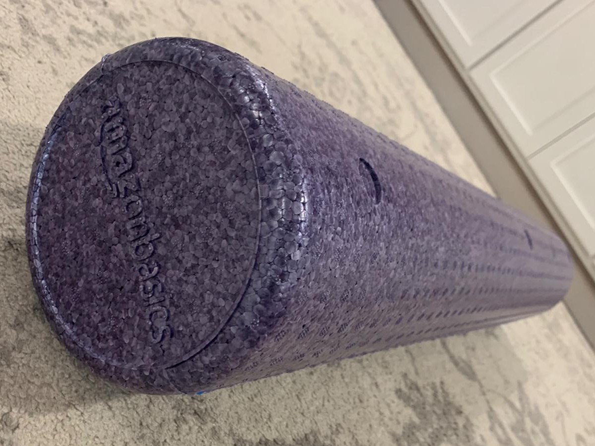 purple foam roller on floor