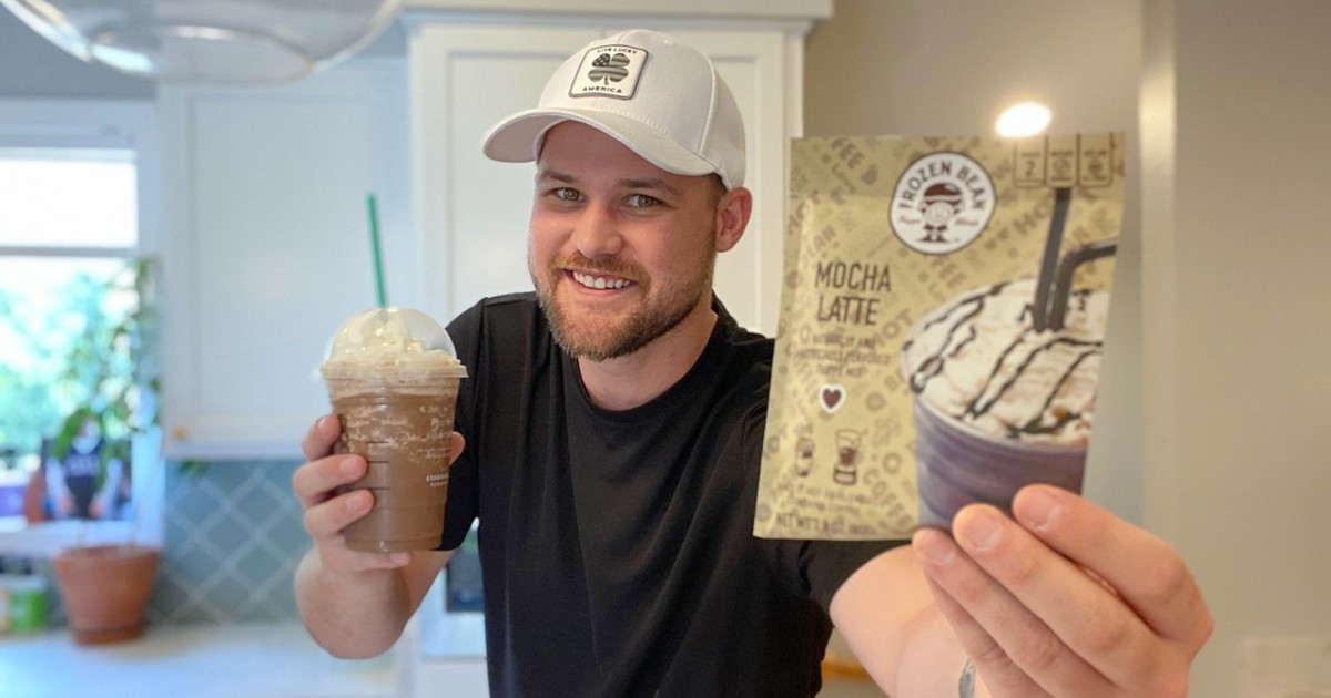 man holding frappuccino from Starbucks and mix packetand 
