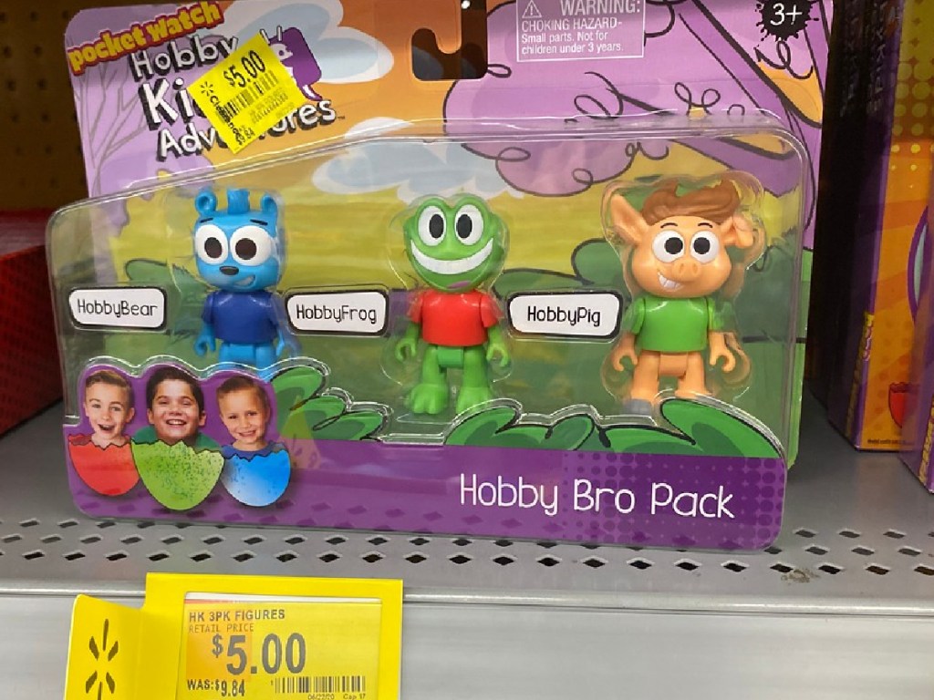 toy with 3 figures in packaging on store shelf