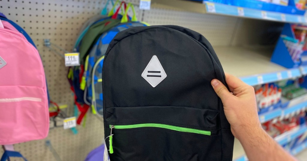 holding backpack at Walgreens 
