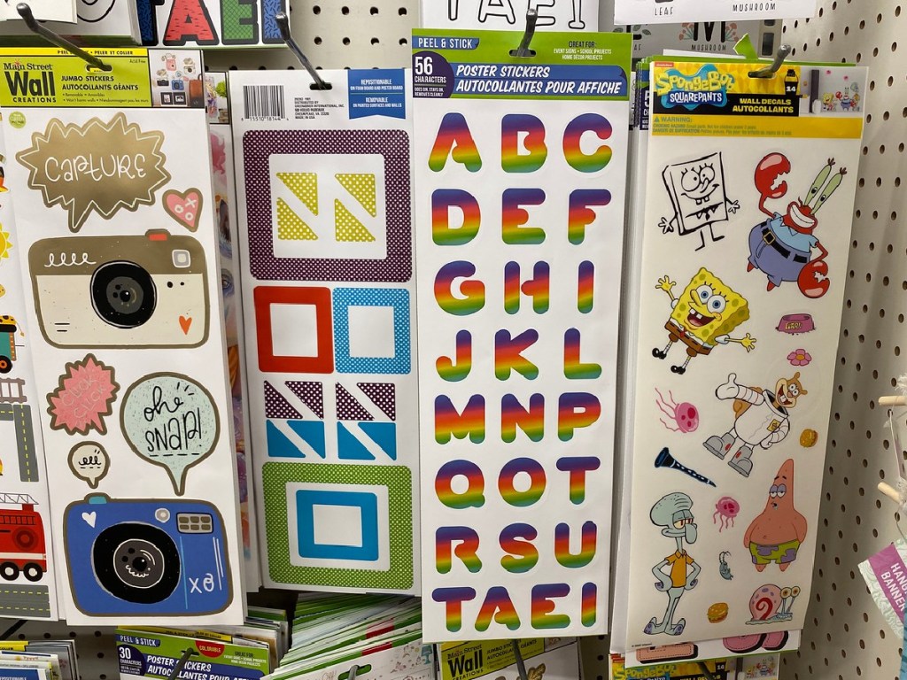 stickers on paper sheets hanging in store