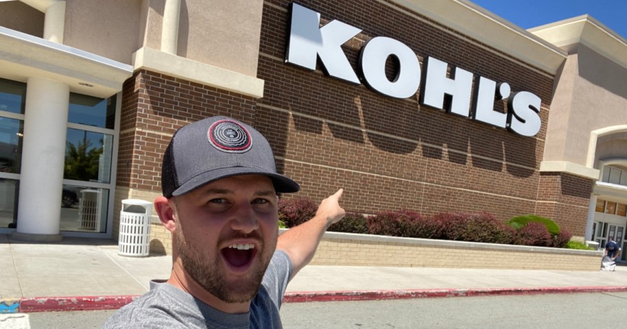 man standing outside of kohls store