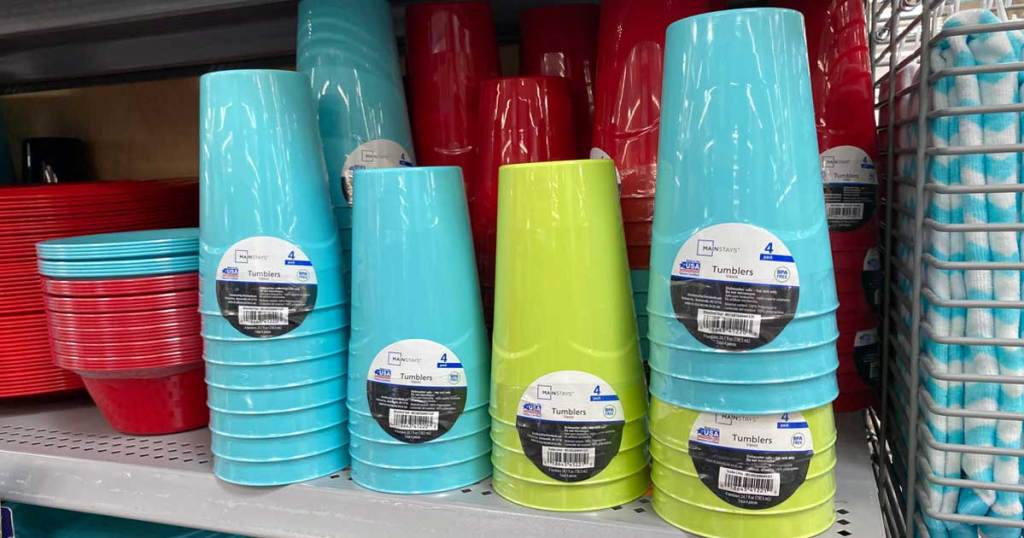 Stacks of colorful plastic cups on store shelf