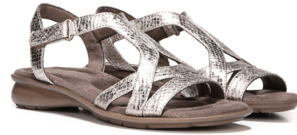 pair of women's sandals that are shiny and on white background