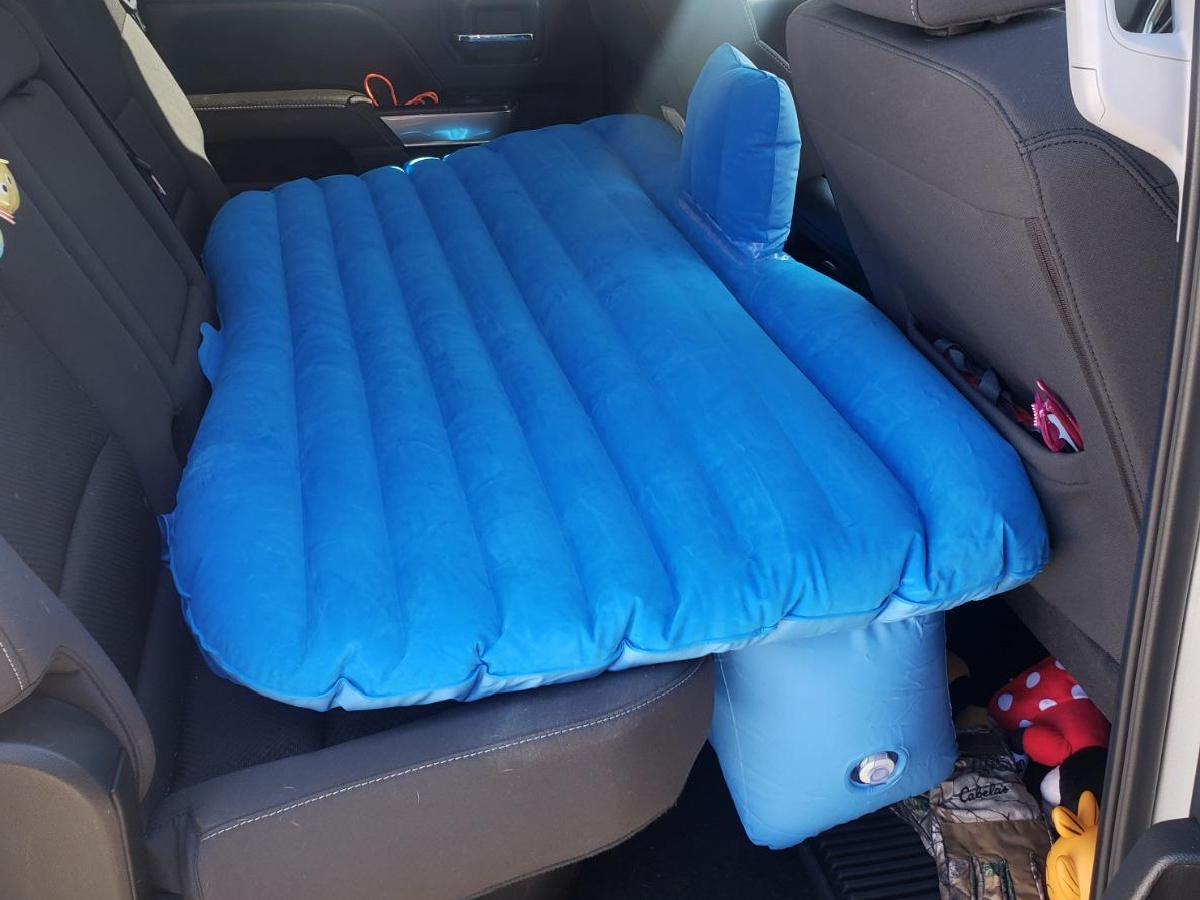 blue air mattress in back seat of car