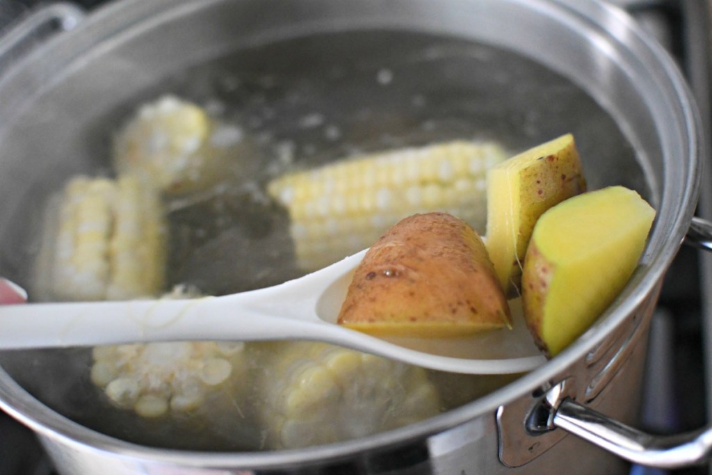 par-boiling corn and potatoes
