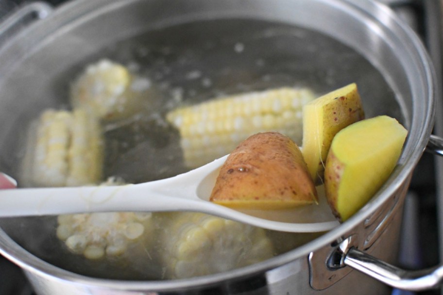 par-boiling corn and potatoes