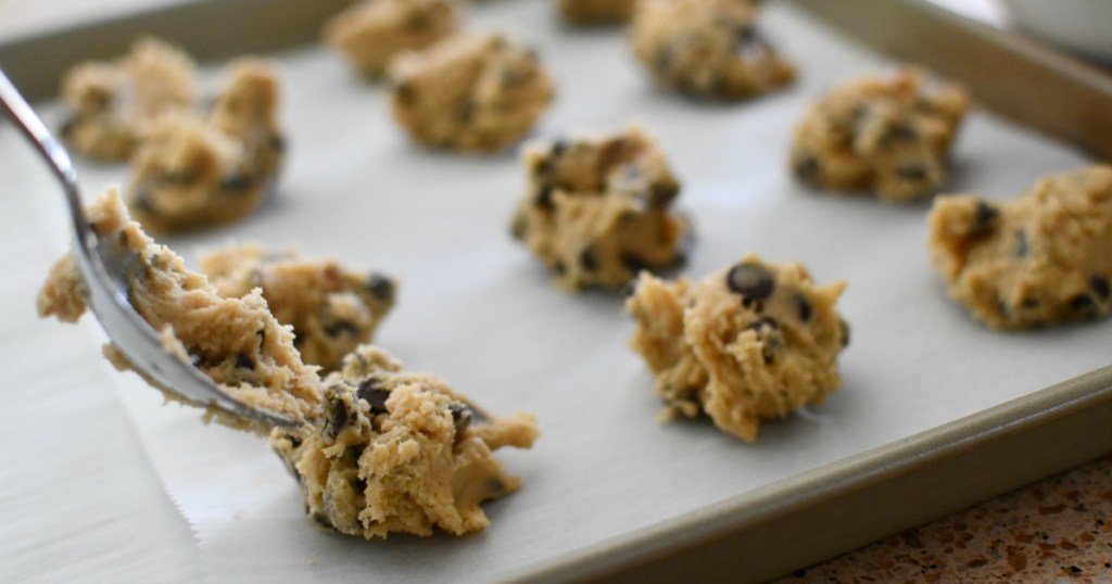 placing cookies on a baking sheet pan