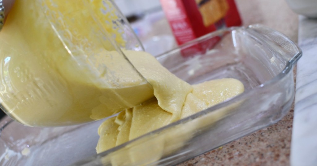 pouring cake batter in a pan