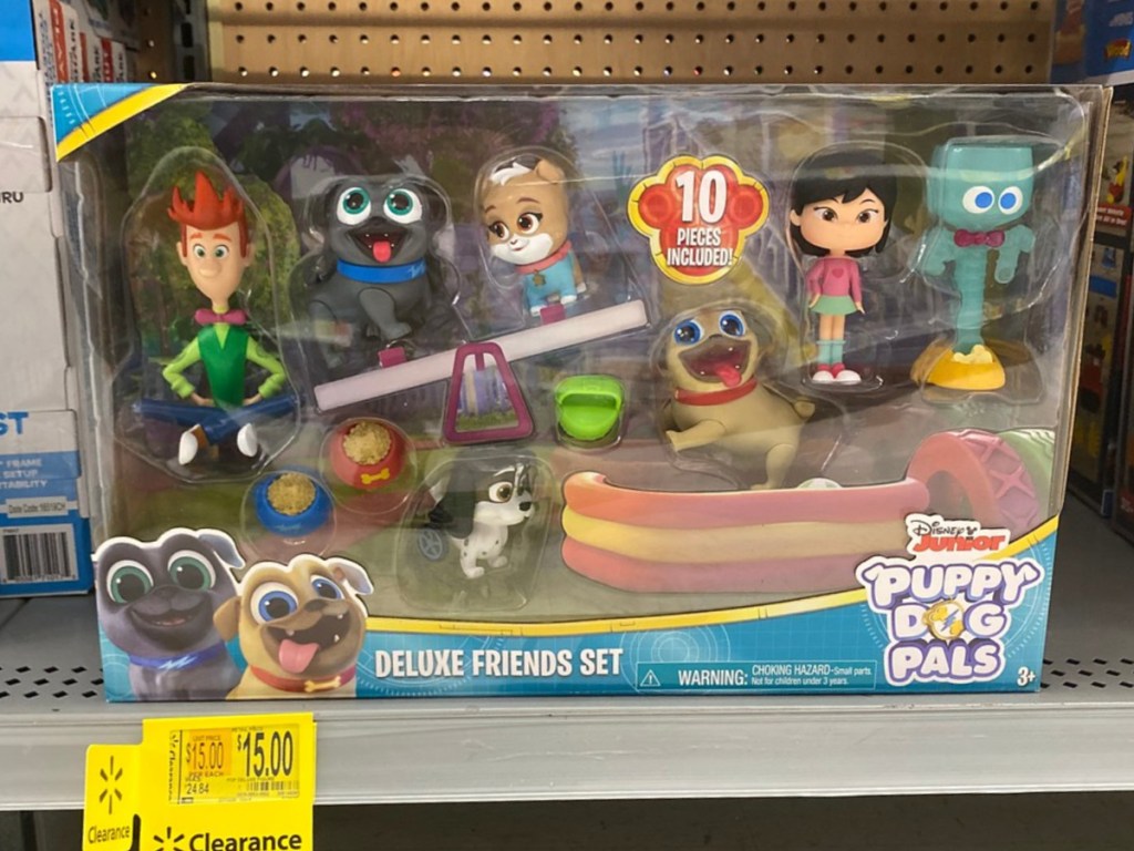 toy with small puppies in package on store shelf