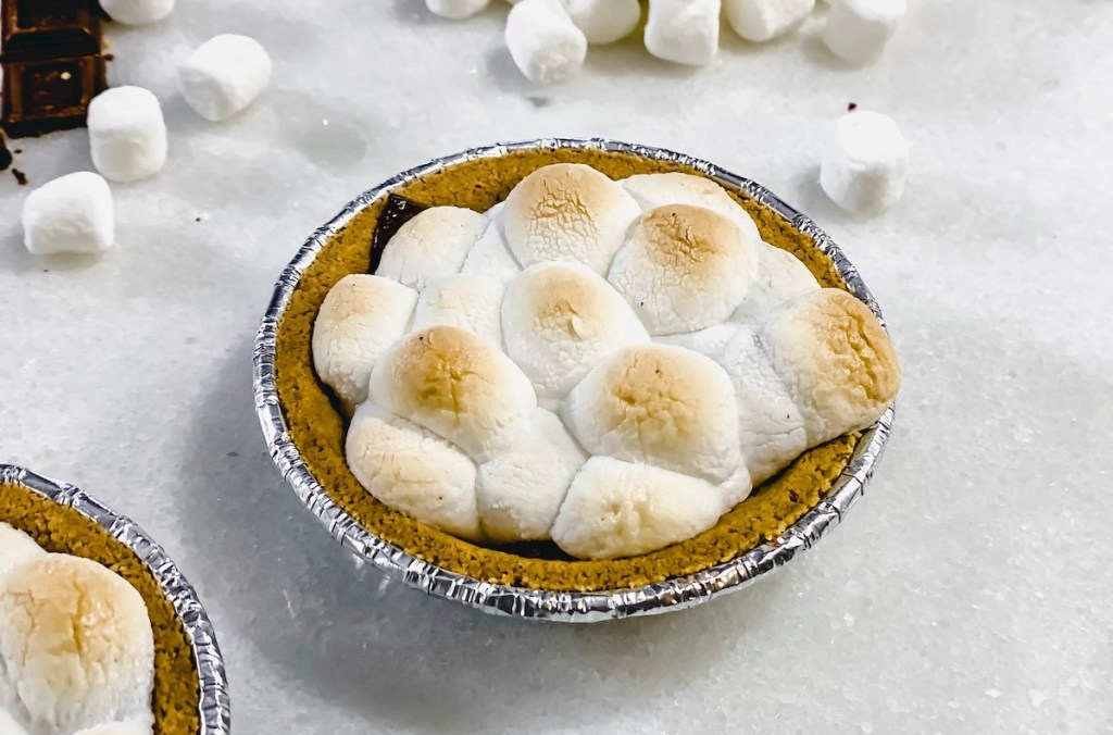 mini smores pie on counter with roasted marshmallows on top