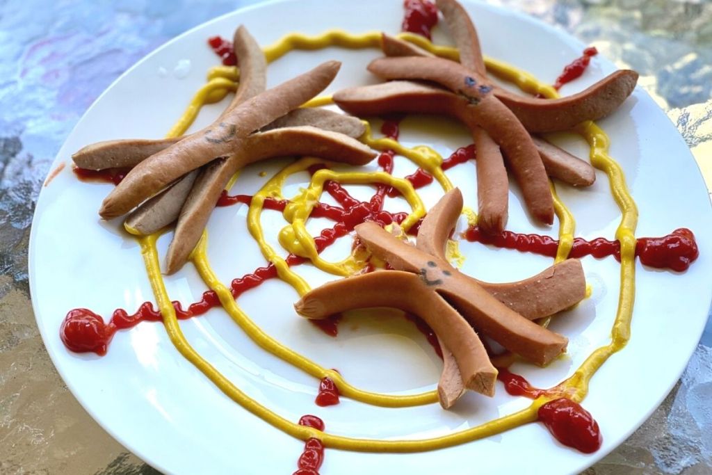 Spider-shaped franks on a plate