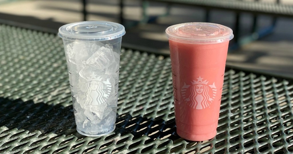 two Starbuck cups with pink drink in one and ice in another