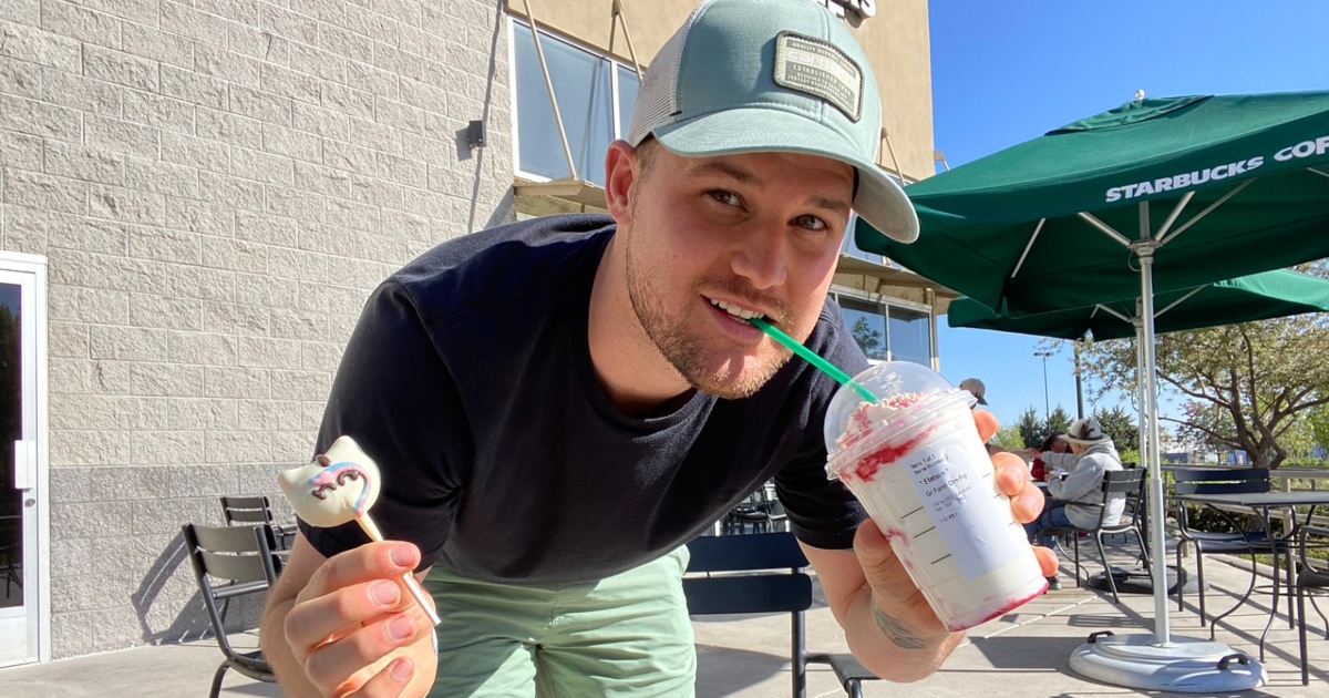 man holding cake pop and sipping Starbucks Frappucino