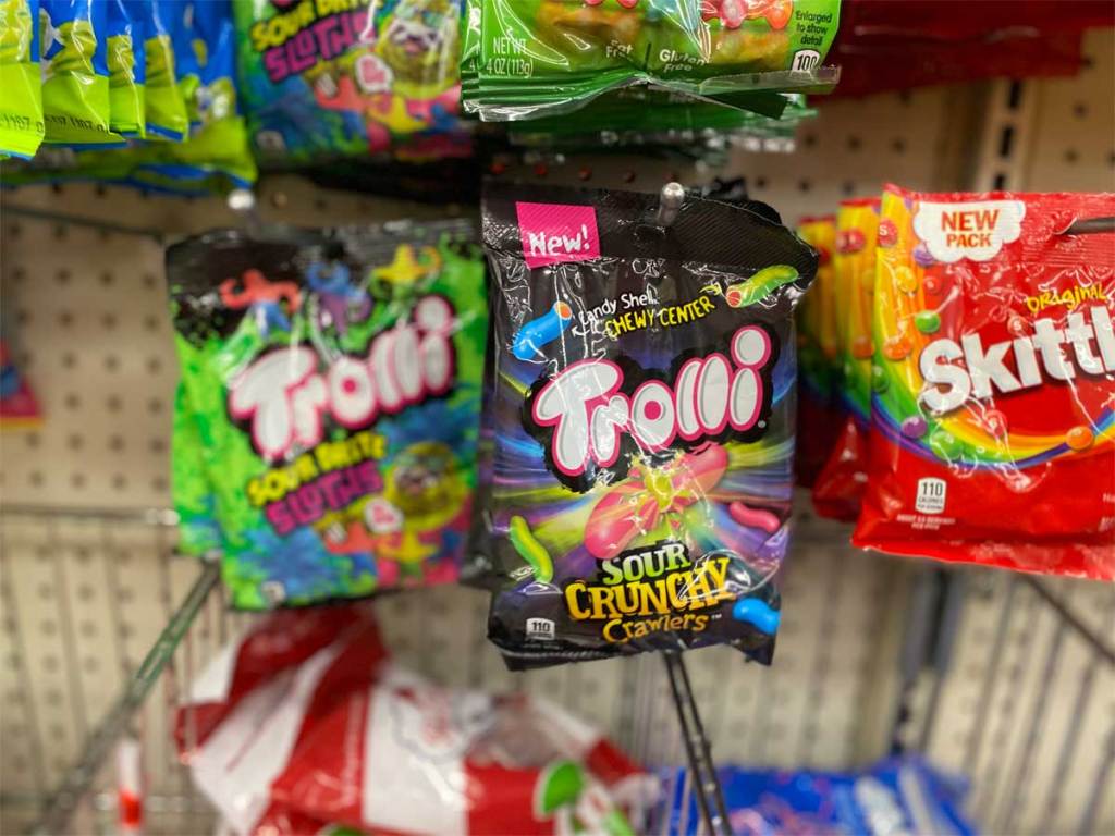 bags of candy hanging on display in store