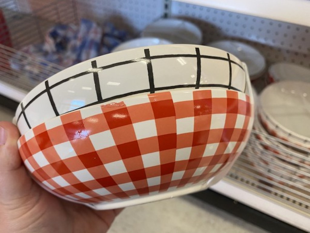 red checkered and white with black squares bowls being held up from the Target Bullseye