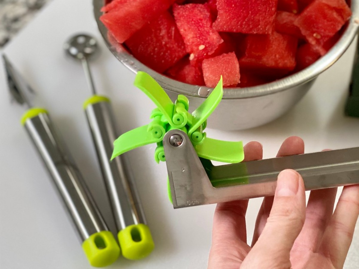 hand holding windmill watermelon slicer