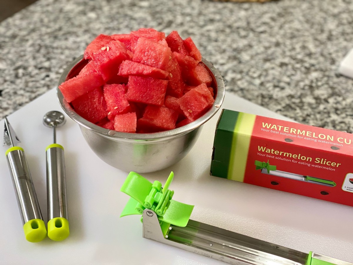 bowl of watermelon cubes with slicing tool